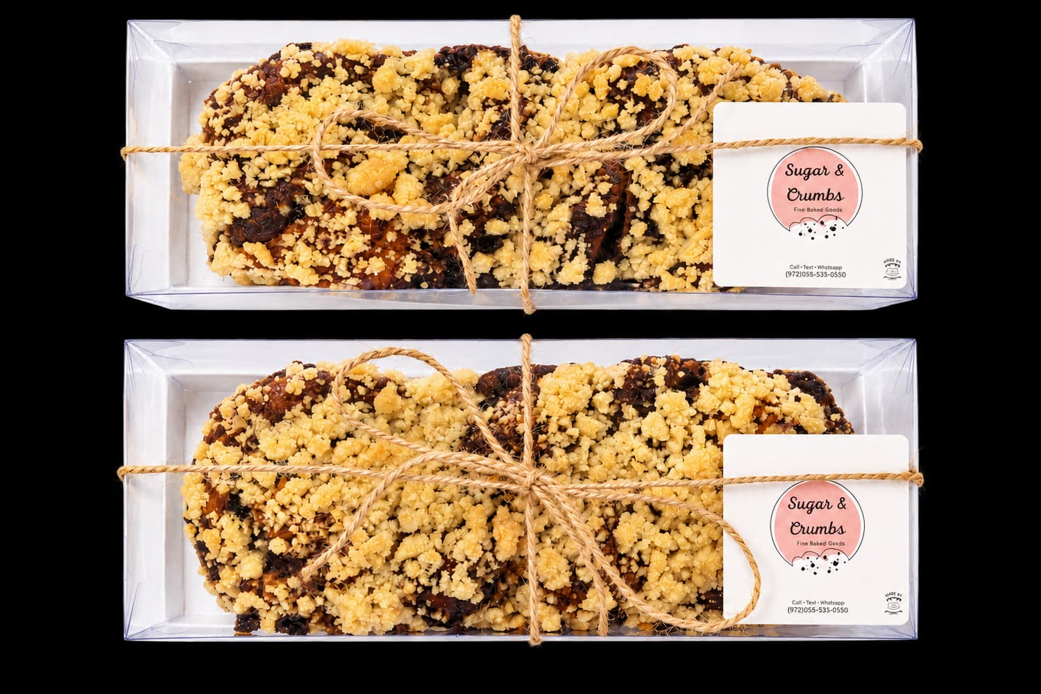 Two Sugar and Crumbs chocolate babka loaves wrapped in gift boxes