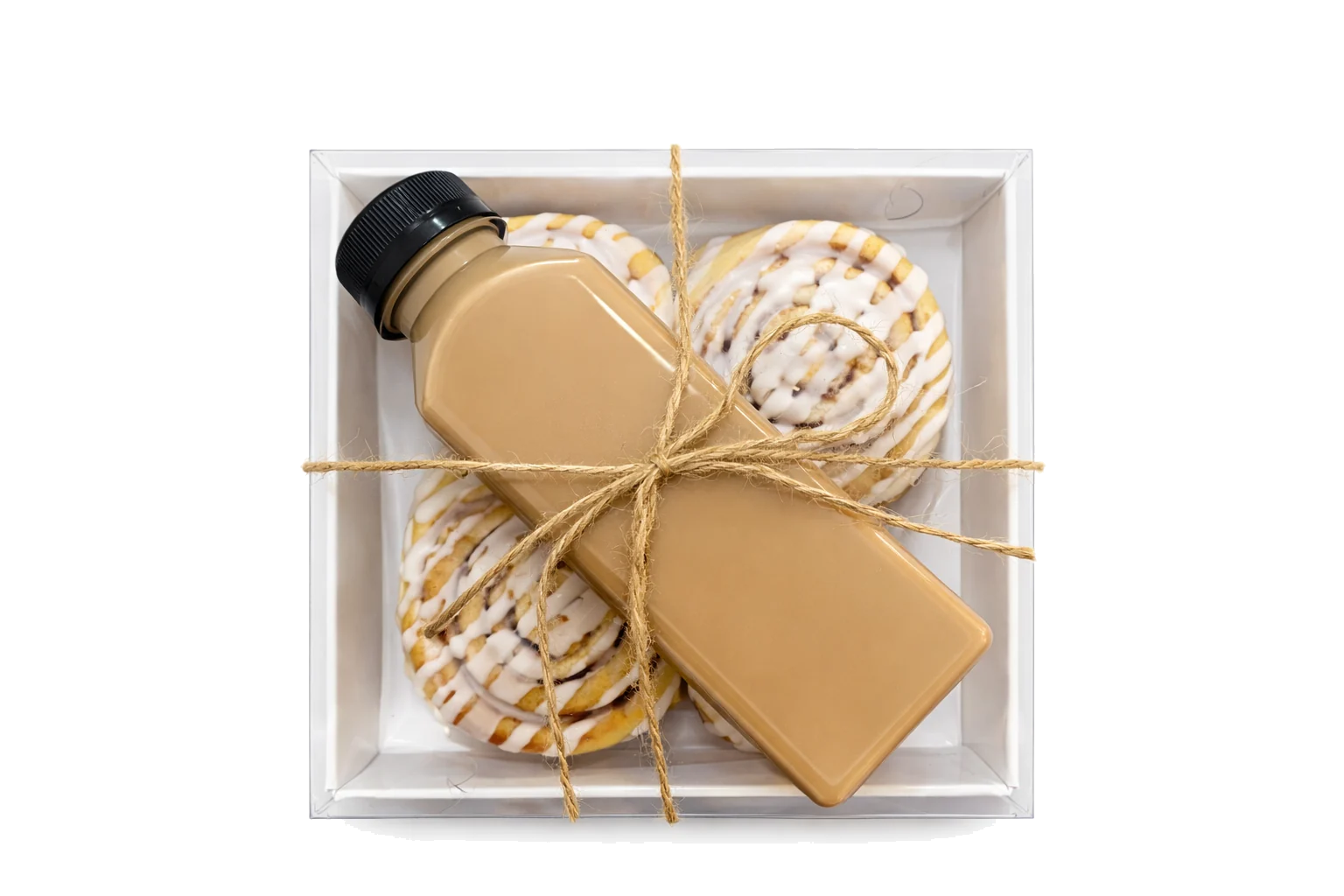 Freshly iced cinnamon buns prepared with coffee for delivery